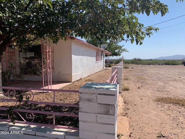 view of home's exterior with a mountain view