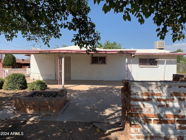 single story home with a patio and cooling unit