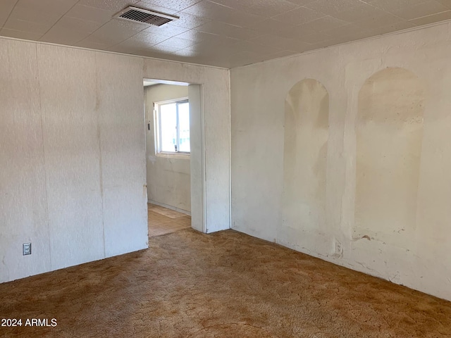 unfurnished room featuring carpet flooring