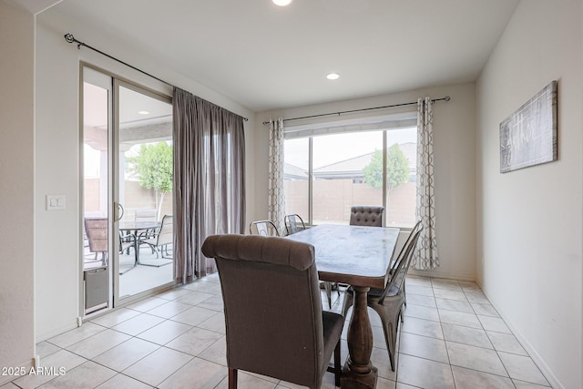 dining area featuring recessed lighting, light tile patterned flooring, and baseboards