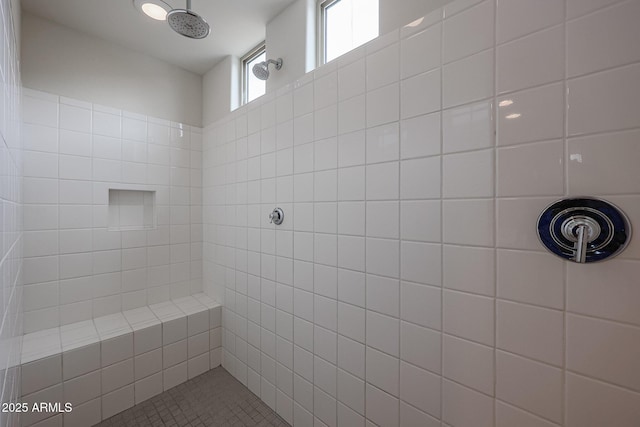 full bath with a tile shower