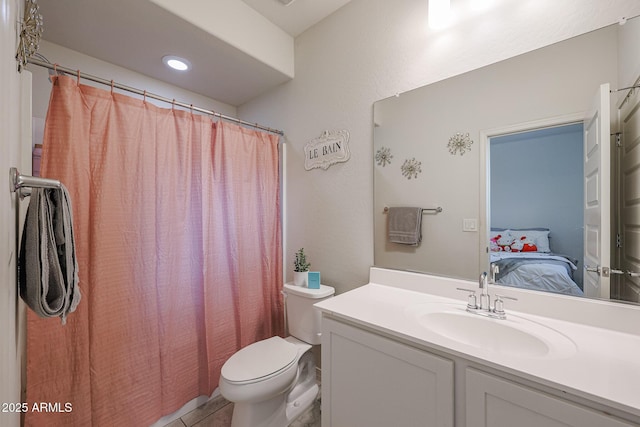 ensuite bathroom with tile patterned flooring, toilet, vanity, a shower with curtain, and ensuite bath