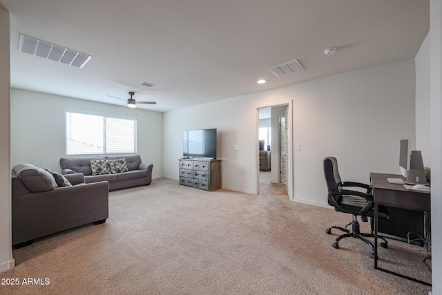 office with light colored carpet, visible vents, and baseboards