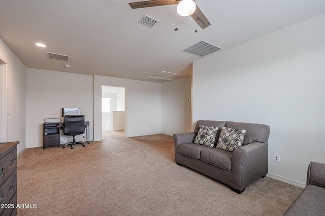 office area with recessed lighting, visible vents, and light colored carpet