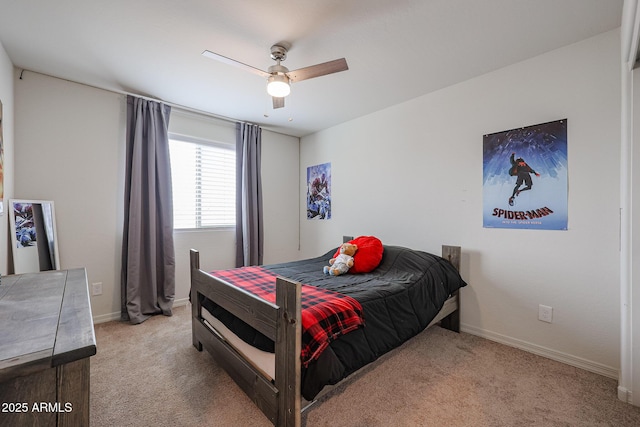 bedroom featuring carpet floors, baseboards, and a ceiling fan