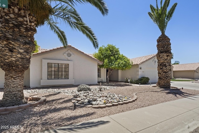 843 E Vera Ln, Tempe, AZ 85284 - view of front facade featuring stucco siding, a tile roof, a garage, and driveway