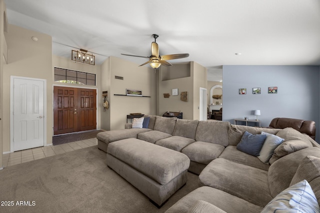 843 E Vera Ln, Tempe, AZ 85284 - carpeted living room with tile patterned flooring, a ceiling fan, and a chandelier