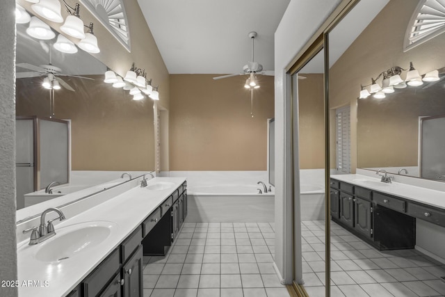 843 E Vera Ln, Tempe, AZ 85284 - bathroom featuring a ceiling fan, double vanity, a bath, tile patterned floors, and vaulted ceiling