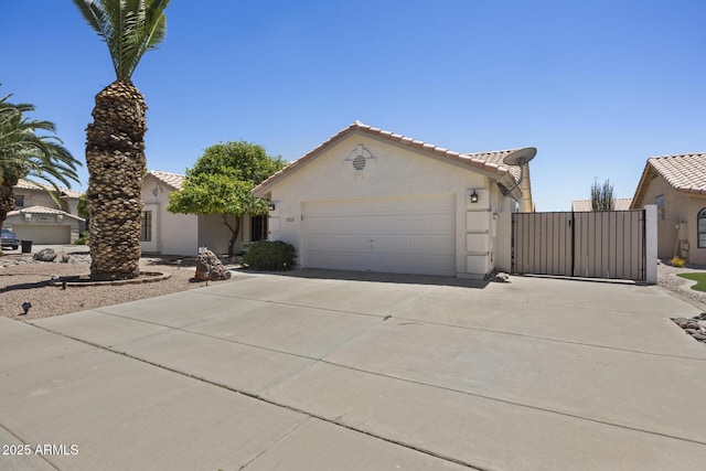 843 E Vera Ln, Tempe, AZ 85284 - view of front of property featuring stucco siding, a tile roof, and concrete driveway
