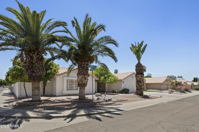 843 E Vera Ln, Tempe, AZ 85284 - obstructed view of property with stucco siding, a garage, and concrete driveway