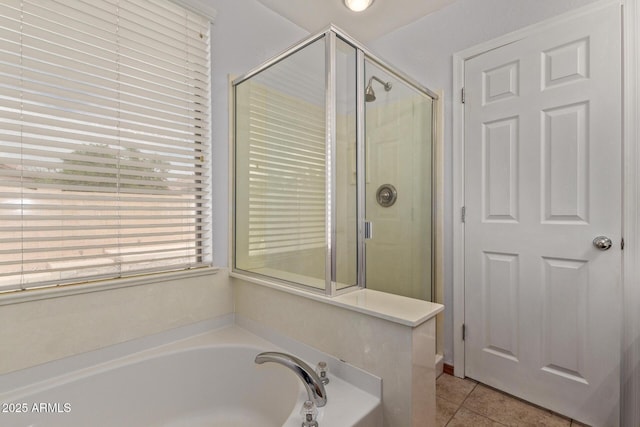 full bath with a bath, a stall shower, and tile patterned flooring