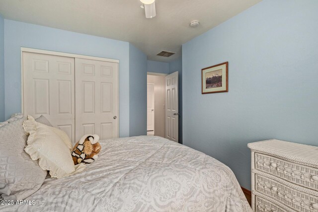 bedroom featuring a closet, ceiling fan, and visible vents