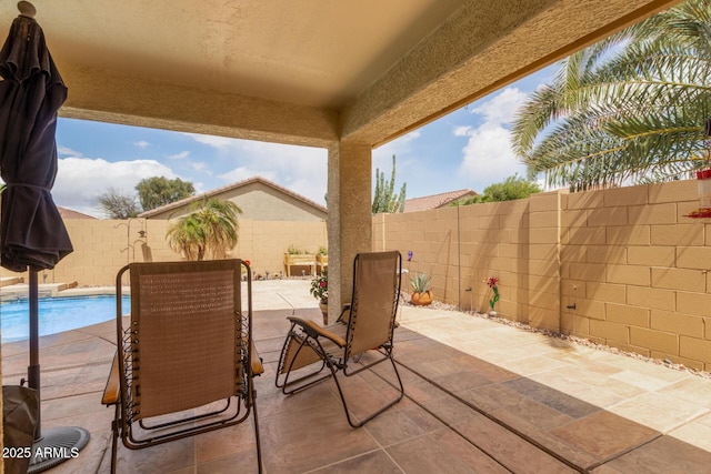 view of patio featuring a fenced backyard and a fenced in pool