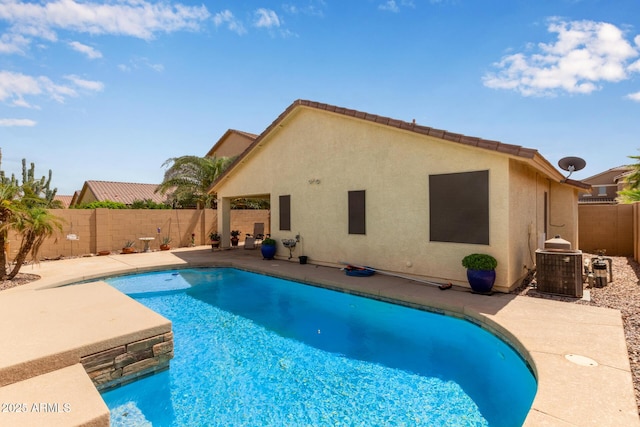 view of swimming pool featuring central air condition unit, a fenced backyard, a fenced in pool, and a patio area