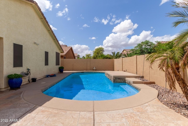 view of swimming pool featuring a patio, a fenced in pool, and a fenced backyard