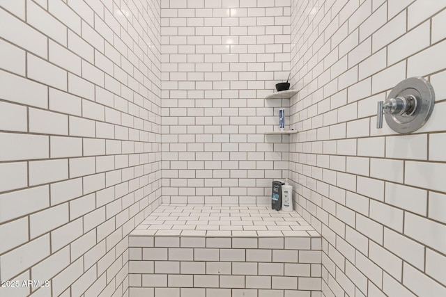 full bathroom with a tile shower