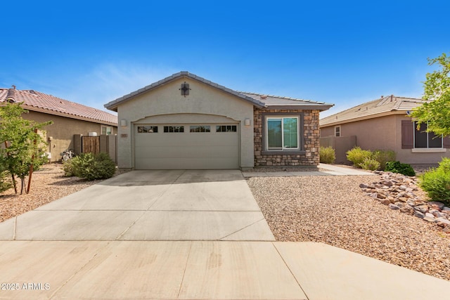 ranch-style home with an attached garage, a tile roof, stone siding, stucco siding, and driveway
