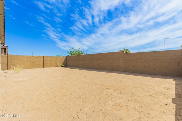 view of yard featuring a fenced backyard
