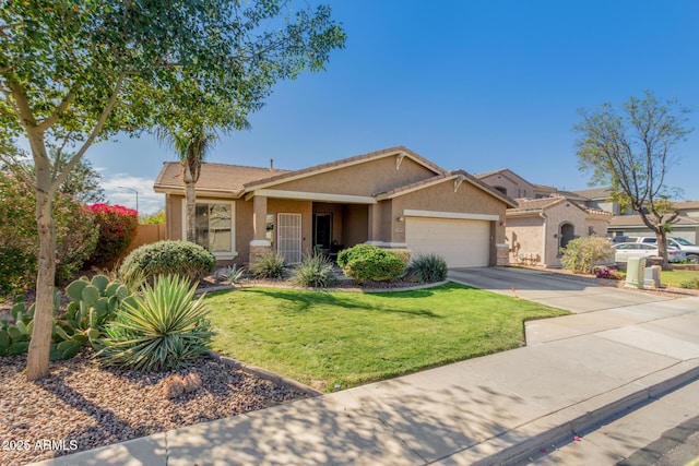 view of front of house featuring driveway, stucco siding, an attached garage, and a front yard