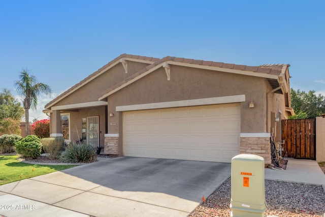 view of front facade featuring stucco siding, concrete driveway, an attached garage, fence, and stone siding