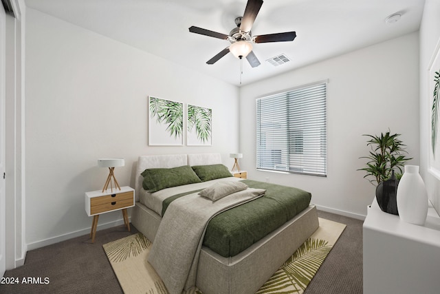bedroom featuring ceiling fan, carpet floors, visible vents, and baseboards
