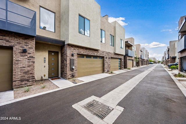 view of road featuring a residential view and sidewalks