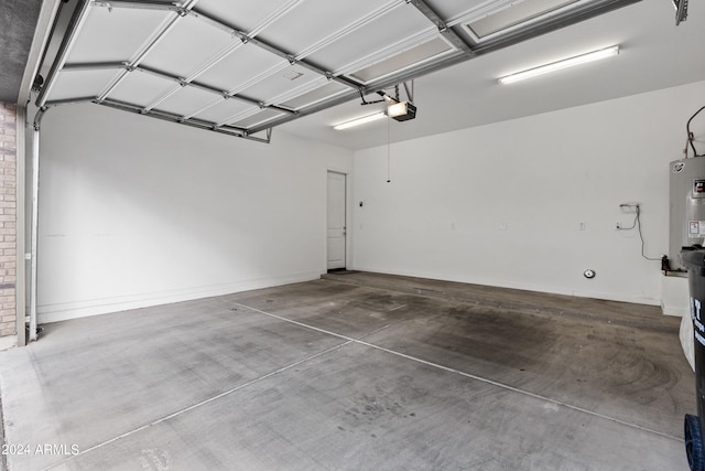 garage featuring water heater and a garage door opener