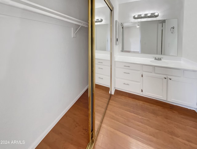 bathroom featuring vanity and hardwood / wood-style flooring