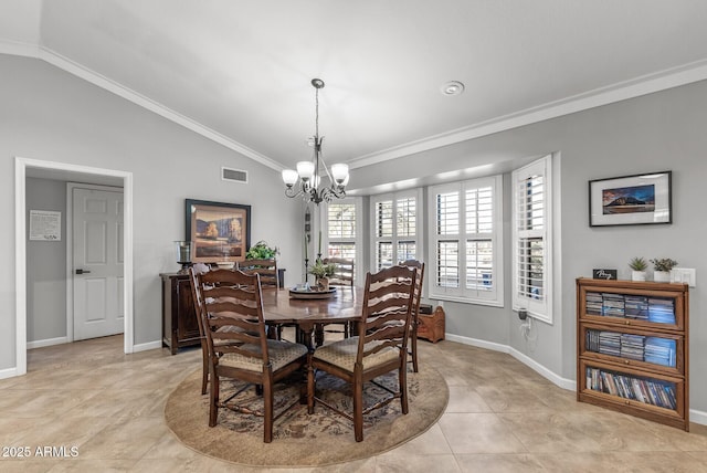 tiled dining area featuring a notable chandelier, lofted ceiling, and ornamental molding