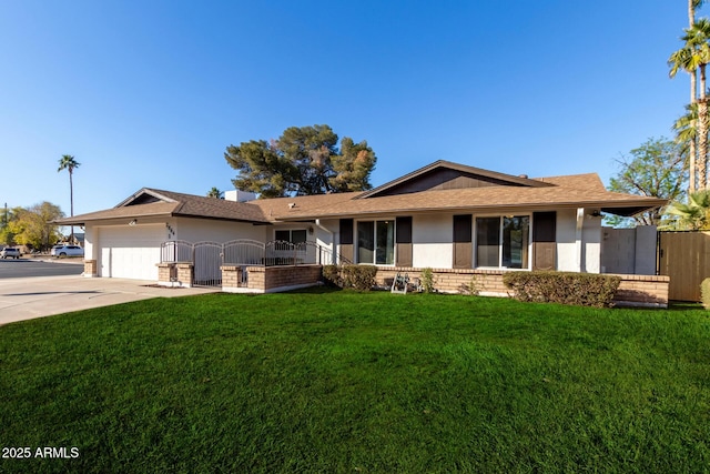 ranch-style house featuring a garage and a front lawn