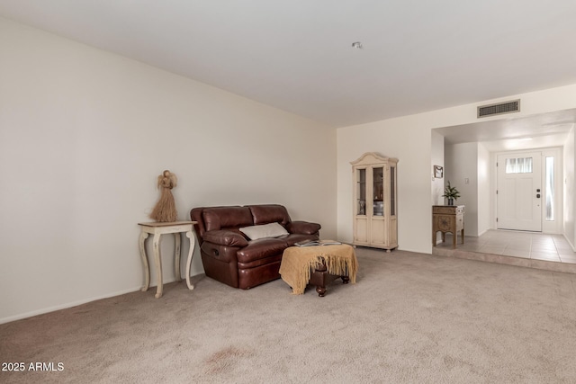 living area with light colored carpet