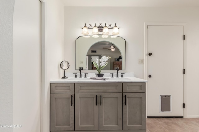 bathroom featuring tile patterned flooring and vanity