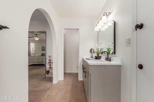 bathroom featuring vanity, ceiling fan, and tile patterned flooring