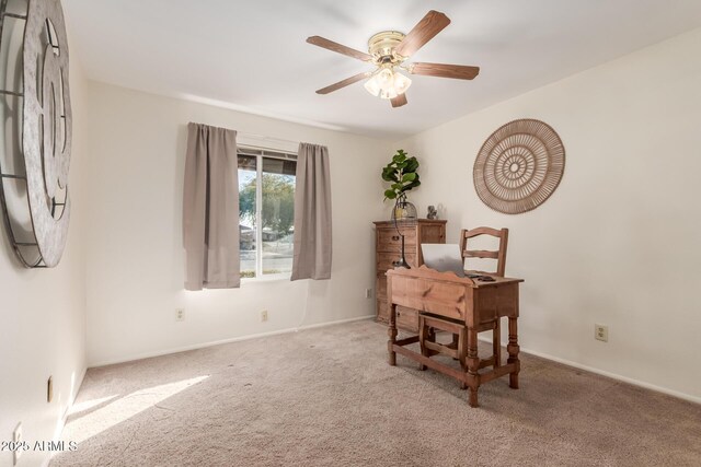 office featuring ceiling fan and light colored carpet