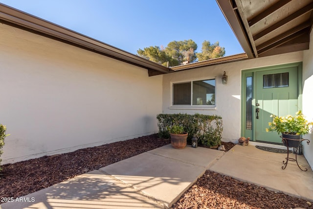 entrance to property with a patio area