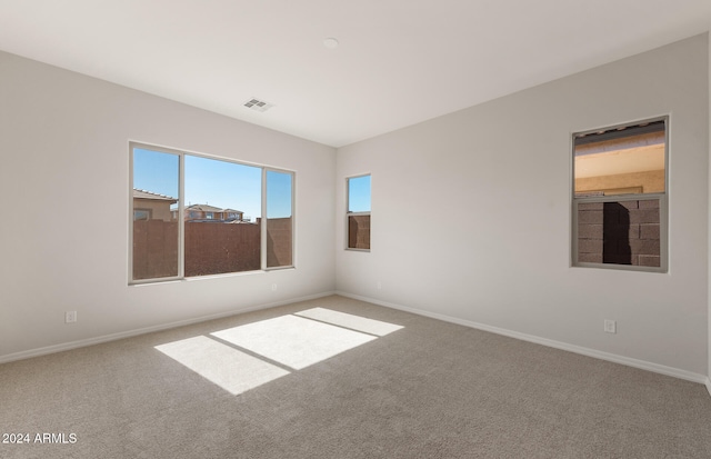 unfurnished room featuring carpet flooring