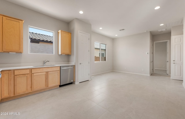 kitchen with a wealth of natural light, sink, dishwasher, and light brown cabinetry