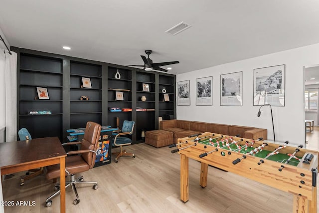 playroom featuring ceiling fan and light wood-type flooring