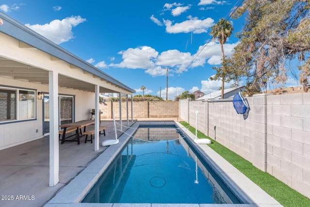 view of swimming pool featuring a patio