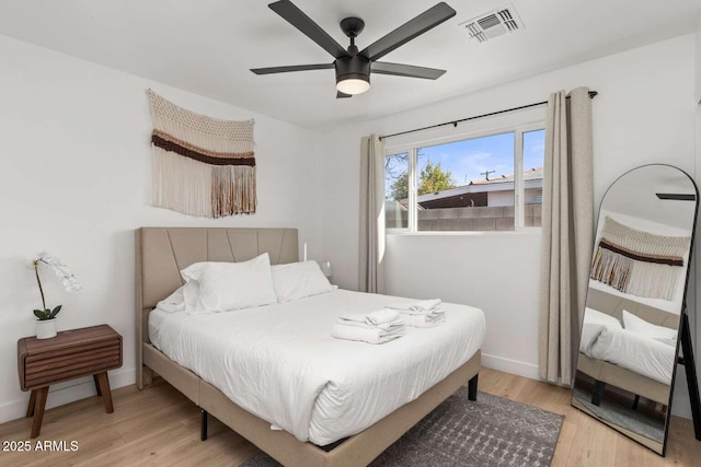 bedroom featuring light hardwood / wood-style flooring and ceiling fan