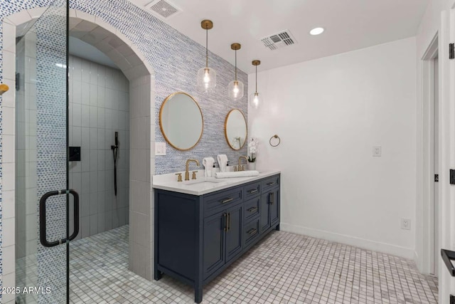 bathroom with vanity, tile patterned flooring, and a shower with door