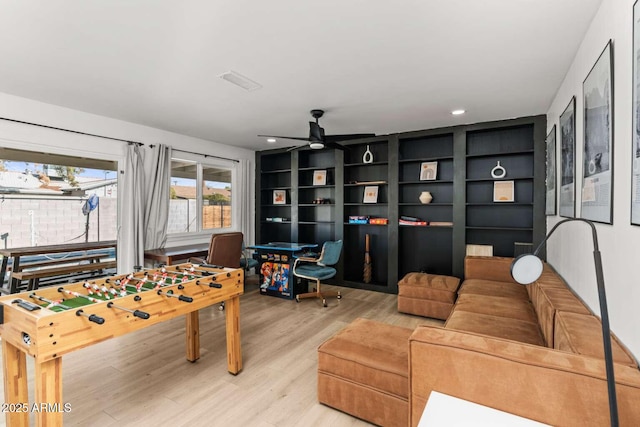 game room with ceiling fan and light hardwood / wood-style floors