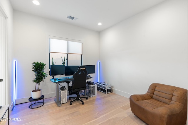 office space with light wood-type flooring