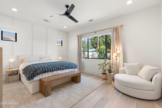 bedroom featuring ceiling fan and light hardwood / wood-style flooring