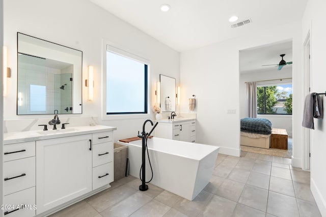 bathroom with tile patterned flooring, vanity, ceiling fan, and independent shower and bath