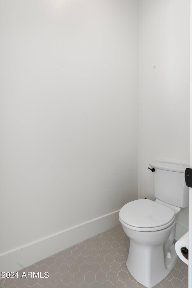 bathroom with tile patterned floors and toilet