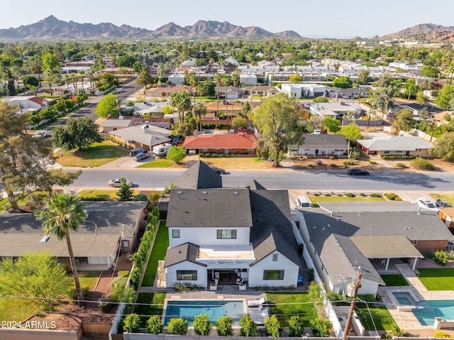 birds eye view of property featuring a mountain view