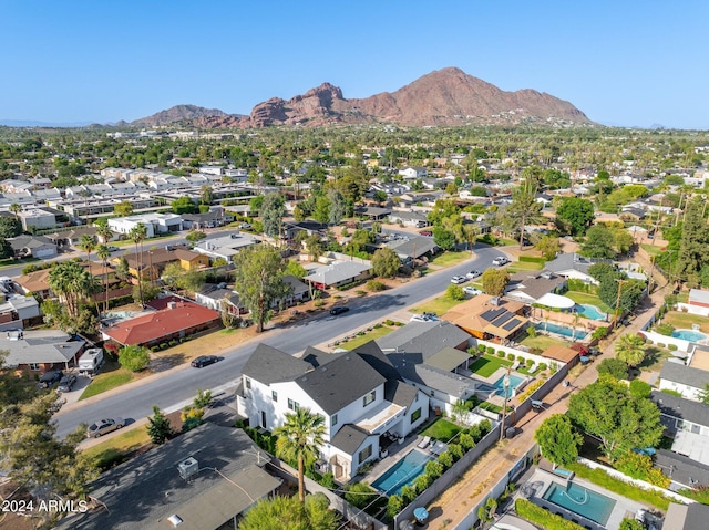 birds eye view of property featuring a mountain view