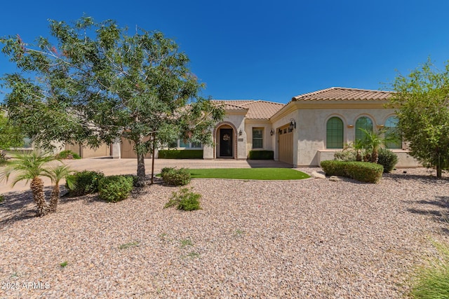 3990 E Iris Dr, Chandler, AZ 85286 - mediterranean / spanish house with an attached garage, a tiled roof, stucco siding, and driveway