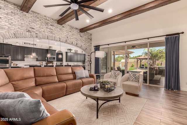 3990 E Iris Dr, Chandler, AZ 85286 - living area featuring a ceiling fan, a high ceiling, beam ceiling, light wood-type flooring, and recessed lighting